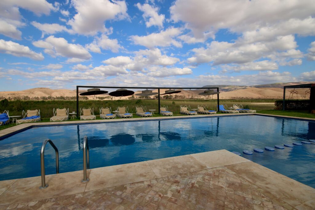 An infinity pool at a luxury desert camp in Agafay, Morocco