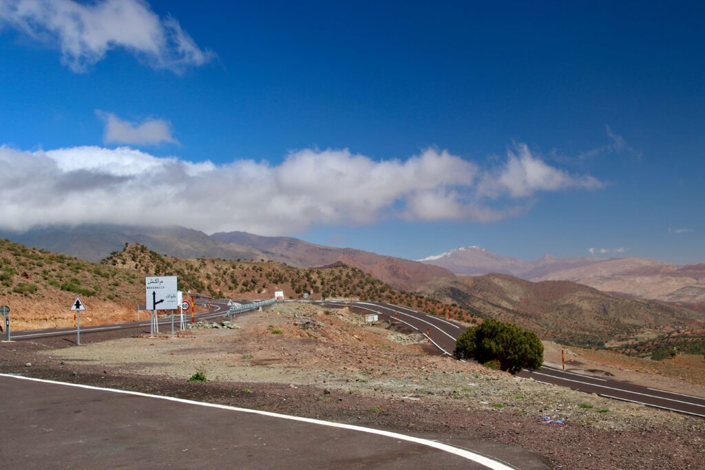 Cheap car hire in Marrakech - A roads winds through the Atlas Mountains towards Tizi n Tichka Pass