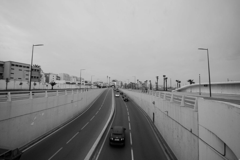 Cars driving along a waterfront road in Casablanca, Morocco