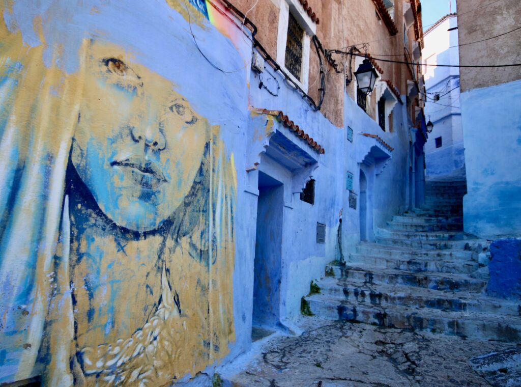 Top tours in Chefchaouen - A mural adorns one of the blue walls in the Chefchaouen medina