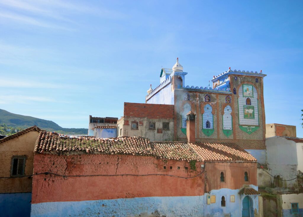 Ochre and blue buildings in Chefchaouen on a one week Morocco itinerary from Tangier to Fes
