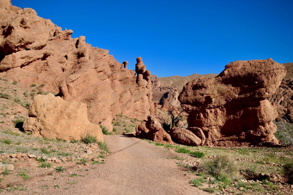 Best places to rent a car in Morocco - Exploring a rocky desert landscape in Dades Gorge with the help of an Agadir rental car