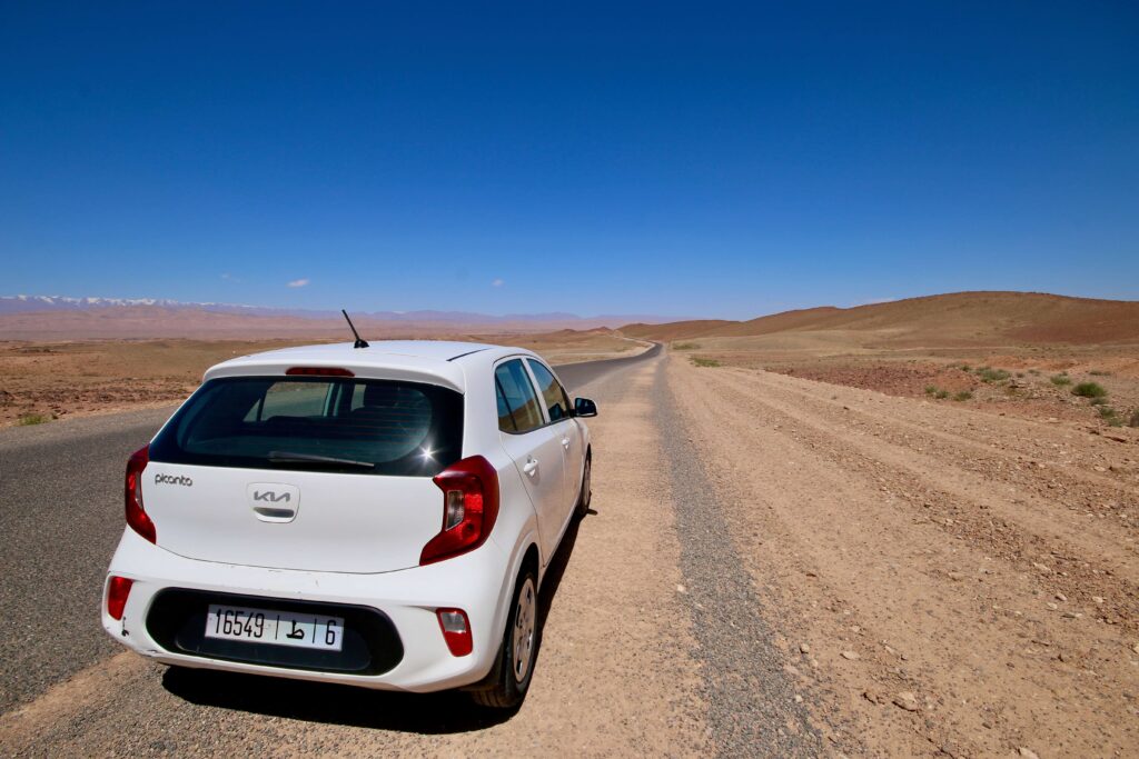 Cheap rental cars in Morocco A rental car parked on a newly asphalted road in Morocco