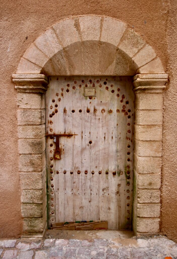 Best day trips and tours in Essaouira - A beautiful old door in the Essaouira medina