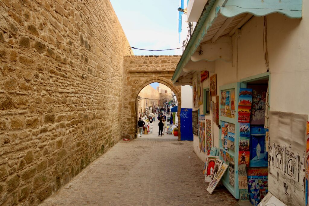 Paintings outside a shopfront along the historic ramparts of Essaouira