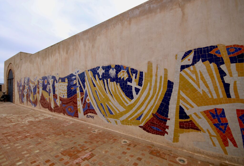 Best museums in Essaouira - A mural adorns a wall at the Essaouira port
