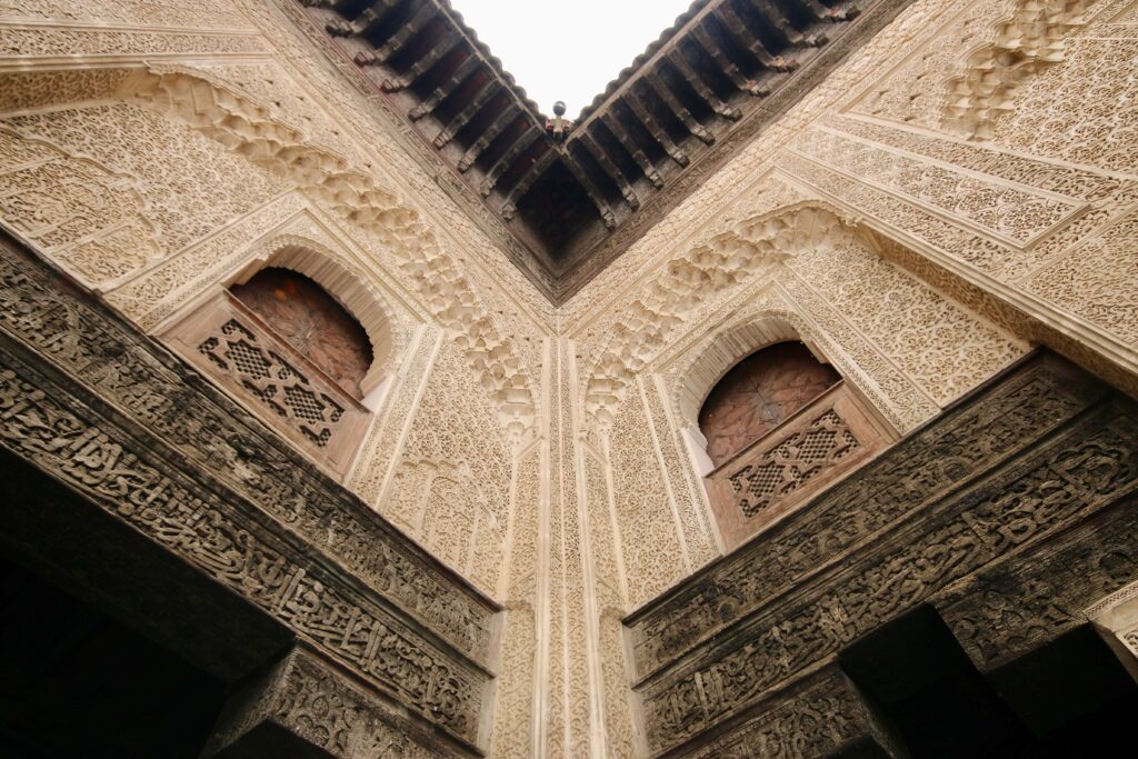Best things to do in Fes in August - gazing up at the intricately carved walls of Bou Inania Madrasa