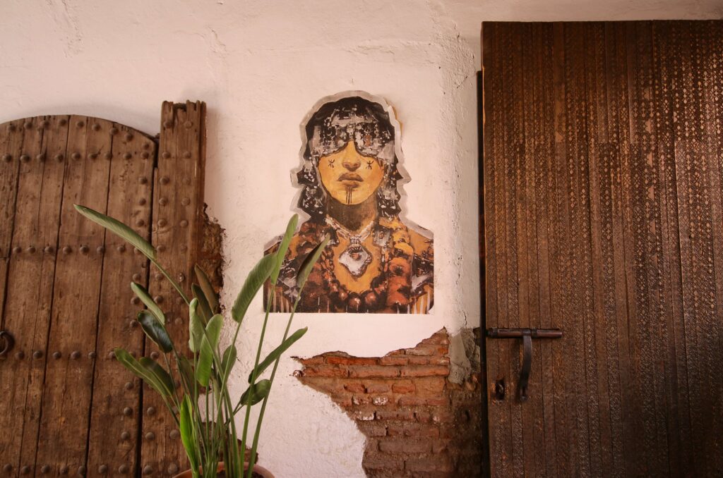 Street art between two wooden doors in the Marrakech medina