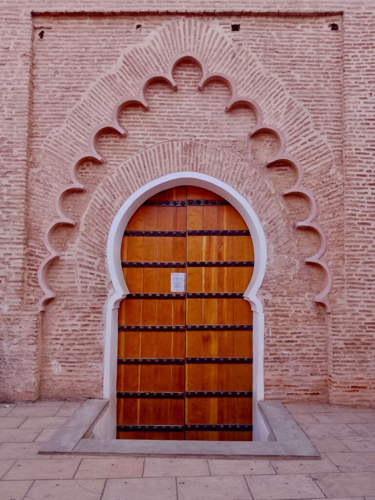 Best things to do in Marrakech - An ornately framed keyhole door in the Marrakech medina