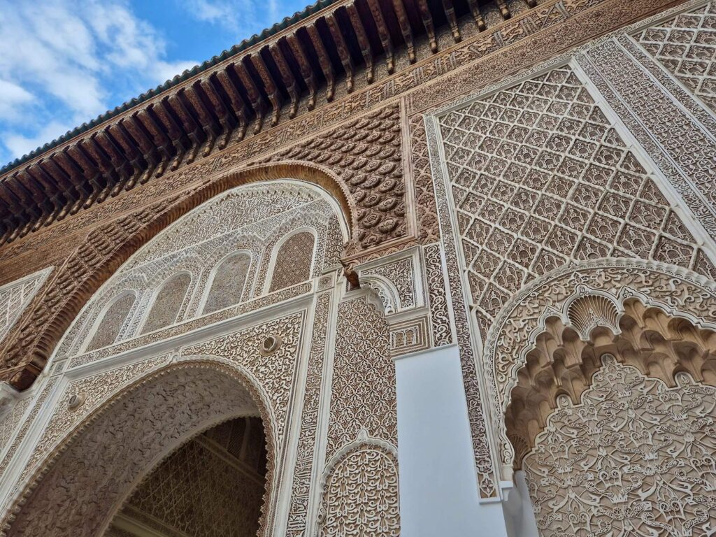 Intricate detailing adorns a courtyard wall at the Ben Youssef Madrasa in Marrakech