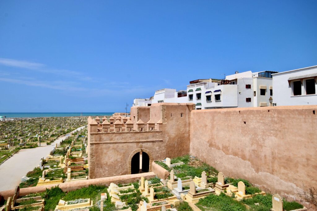 A cemetery sprawls beside the historic city walls of Salé, the sister city of Rabat