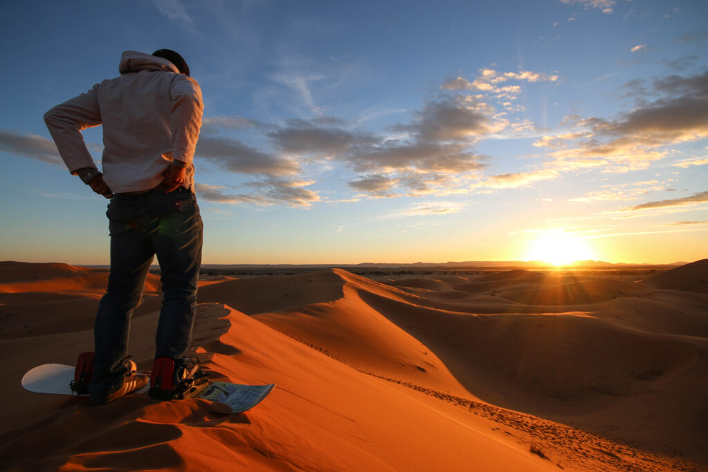 Sandboarding is a popular activity in the Sahara Desert for solo travellers to Morocco
