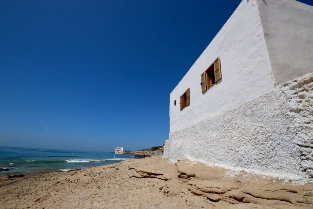 Travel guide to Agadir - A whitewashed building on the coastline near Agadir