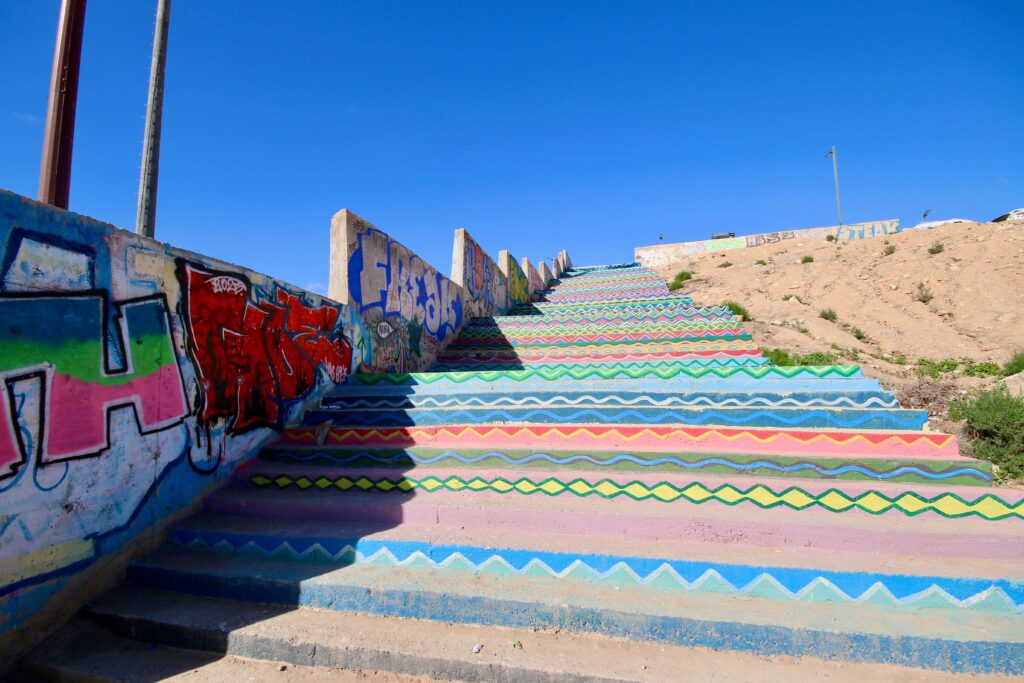 Colourful steps lead up to a carpark above the village of Taghazout