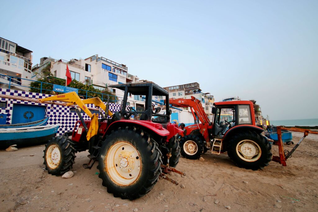 Tractors on Taghazout Beach are used to haul the fishing boats onto the shore