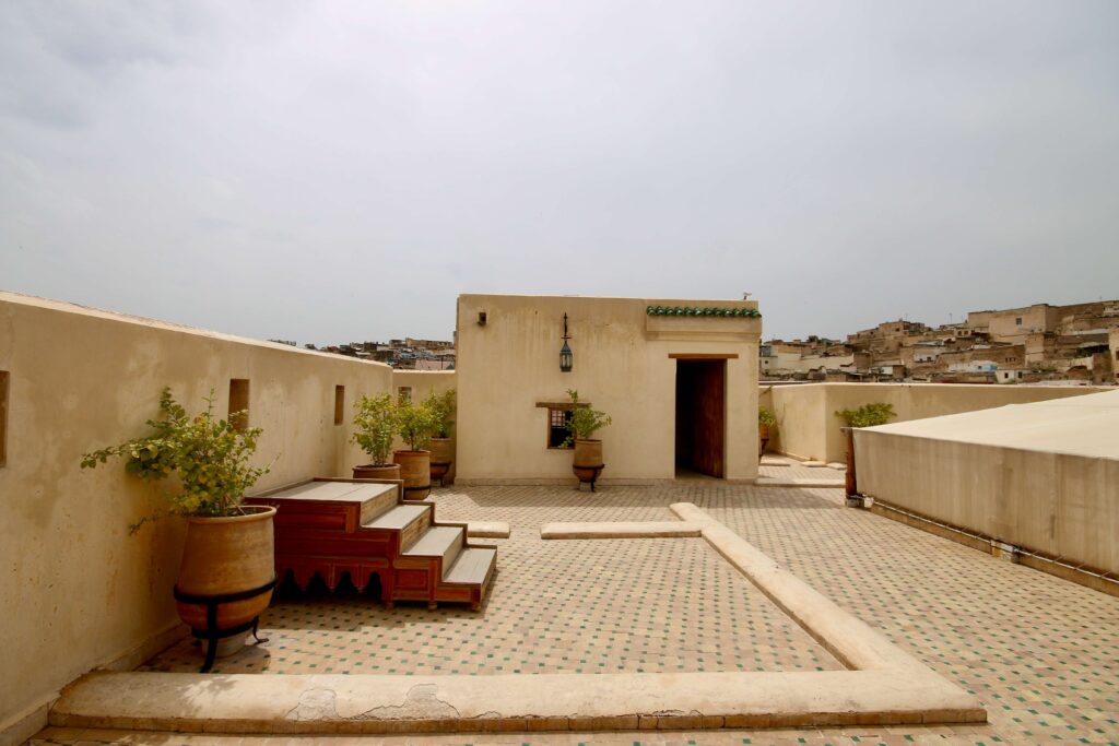Stairs lead up to a wooden platform on the rooftop of the Nejjarine Museum of Wooden Arts & Crafts in Fes