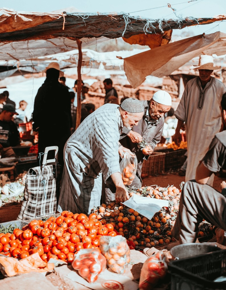 Best things to do in Agdz - Elderly Moroccan men shopping at the Agdz Market