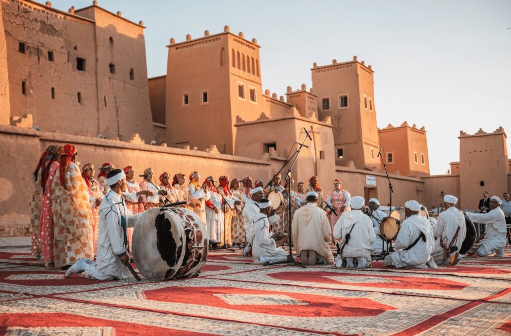 Celebrating Yennayer with Morocco's Amazigh People - Amazigh musicians perform in front of a kasbah during Yennayer celebrations