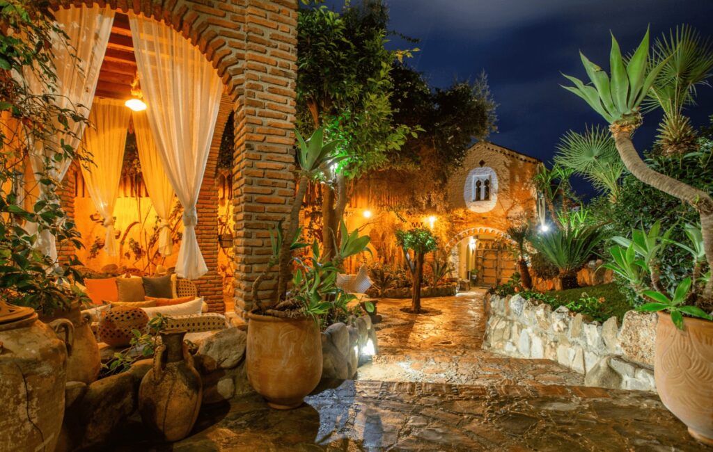 Lanterns illuminate the courtyard at Dar Echchaouen - one of the best luxury hotels in Chefchaouen 