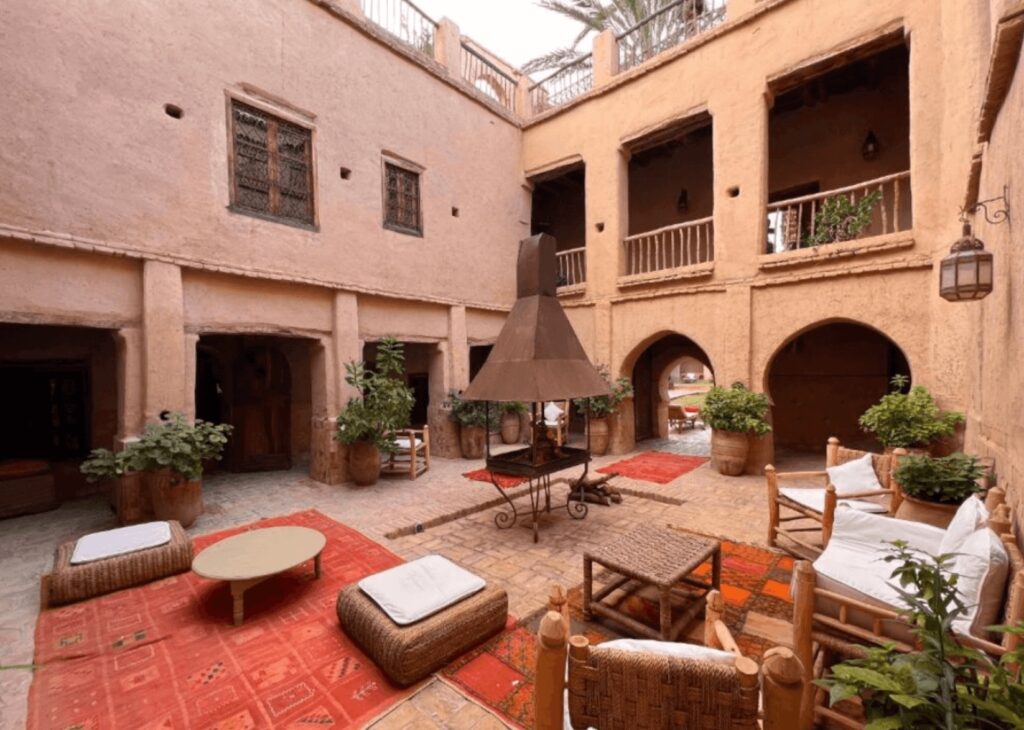 Best places to stay in Taroudant: Ochre walls frame the interior courtyard of Dar Les Dattiers in Taroudant