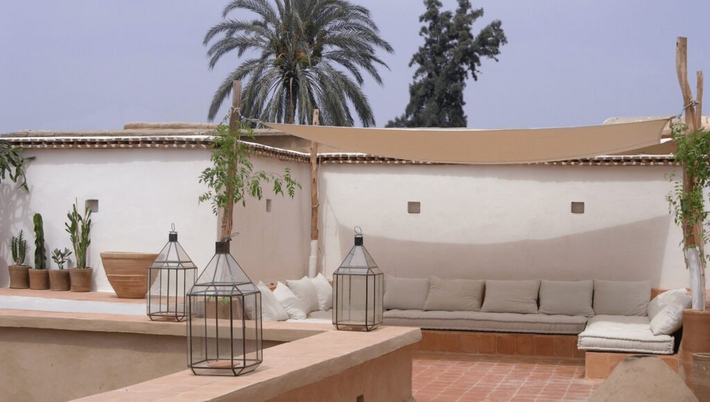 Cushioned loungers on the rooftop terrace at Dar Zahia, one of the best hotels in Taroudant