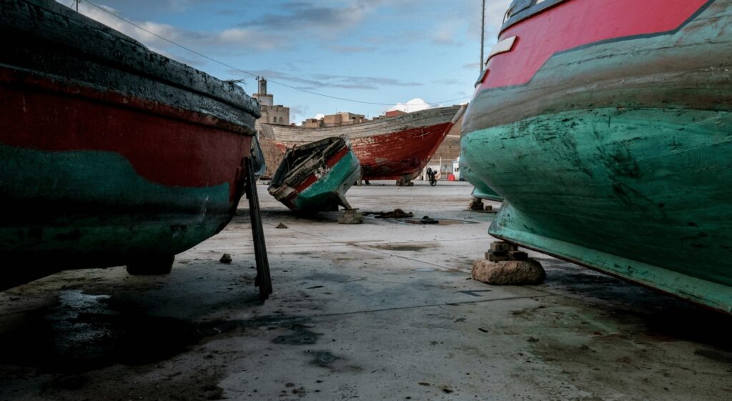 Best things to do in El Jadida - Green and red fishing boats grounded at El Jadida Port