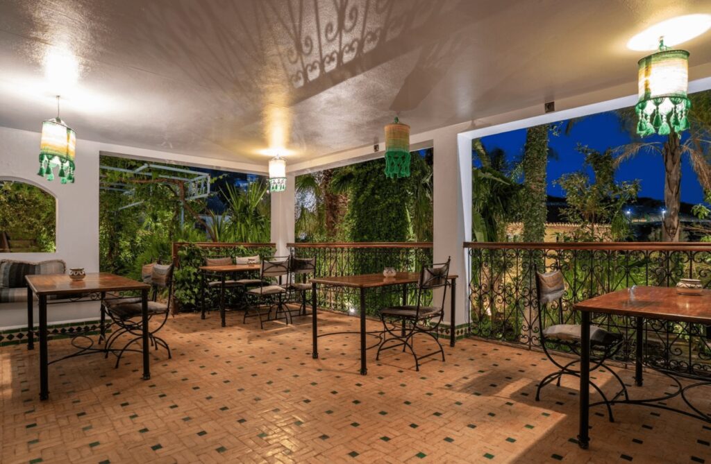 The illuminated dining terrace at Hotel Molino Garden, a budget place to stay in Chefchaouen 