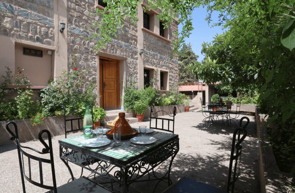 A sun-dappled terrace at Hotel Soleil Imlil, which is one of the best places to stay in Imlil