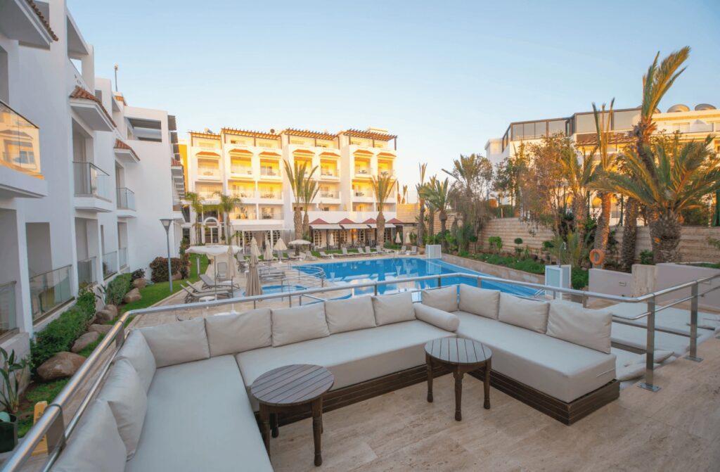 Loungers beside the central swimming pool at Hotel Timoulay and Spa 