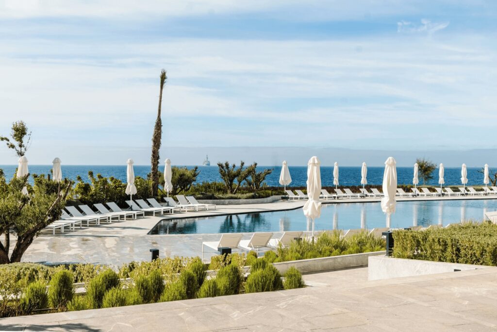 Best luxury hotels in Tangier - Sun loungers beside a pool at the Idou Malabata Beach & Spa near Tangier 