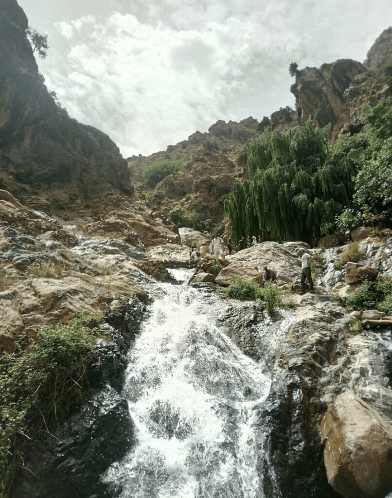 Best things to do in Imlil - A waterfall cascades over a cliff near Imlil, Morocco