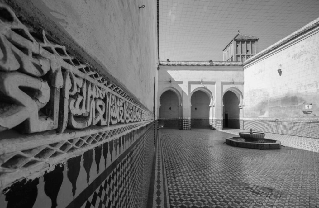 Best things to do in Meknes - Quranic script on the side of a building in Meknes