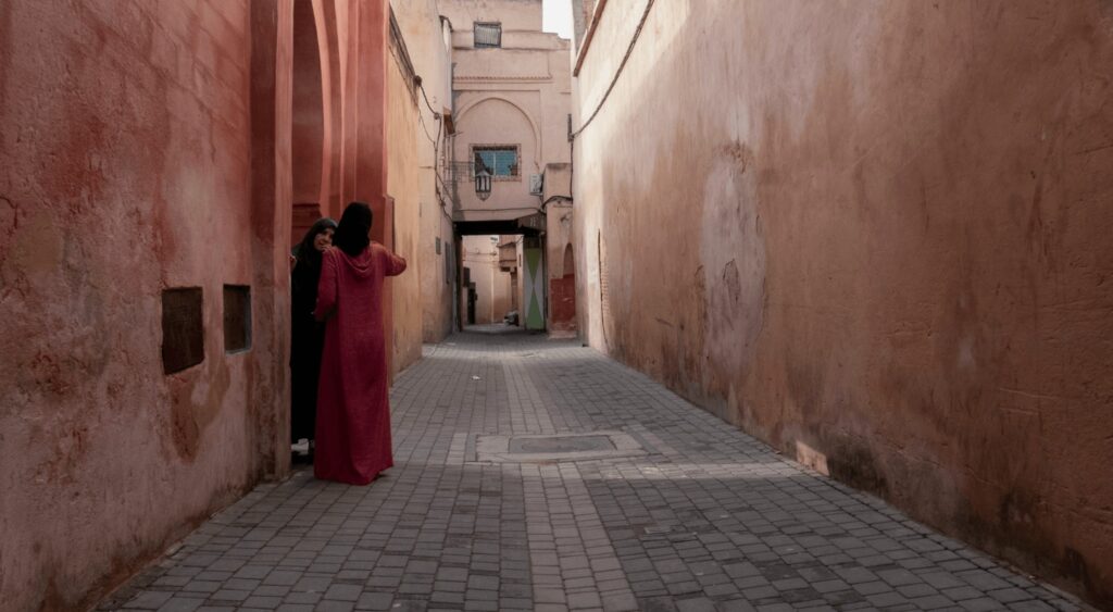 Is Moulay Idriss worth visiting? Two Moroccan women talking in the streets of Meknes