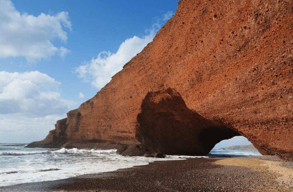 The iconic rock arch of Legzira Beach, which can easily be reached from Mirleft
