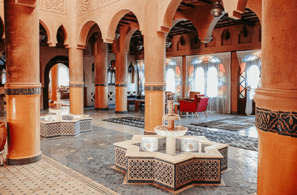 Ochre columns and zellige tile at OZ Palace Ouarzazate, one of the best places to stay in Ouarzazate
