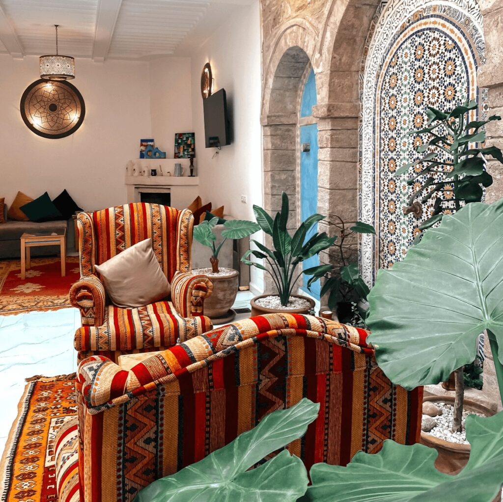 Colourful sofas in a courtyard at a budget hotel in Essaouira