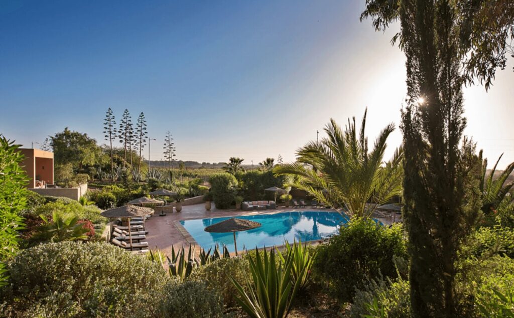 Planning a golf vacation in Agadir - a swimming pool in a garden at a golf riad in Agadir