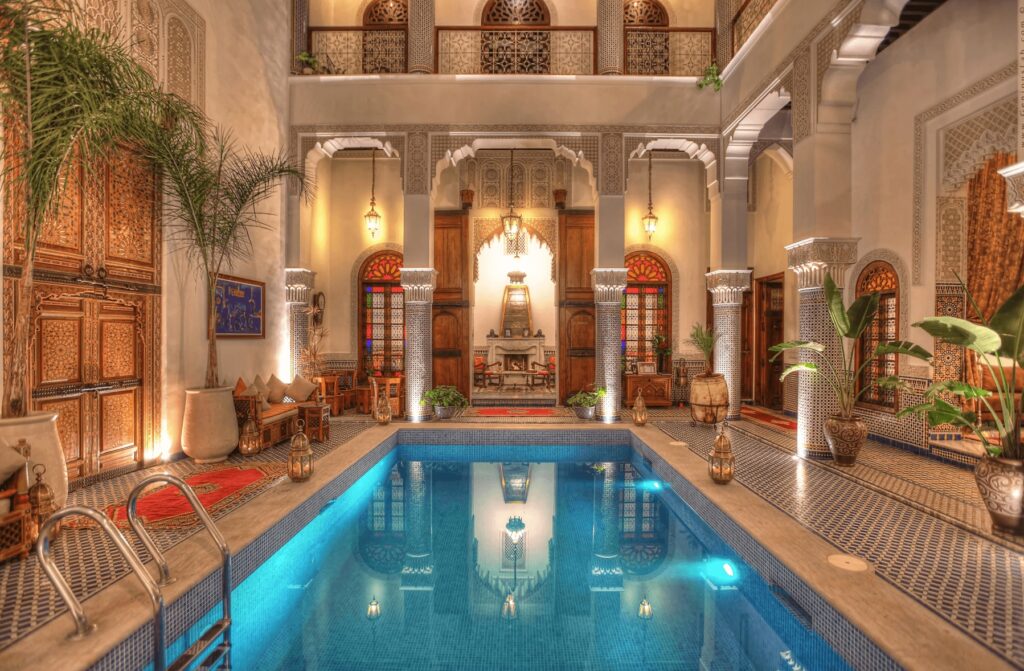 The beautifully decorated internal patio and swimming pool at one of the best 5-star hotels in Fes