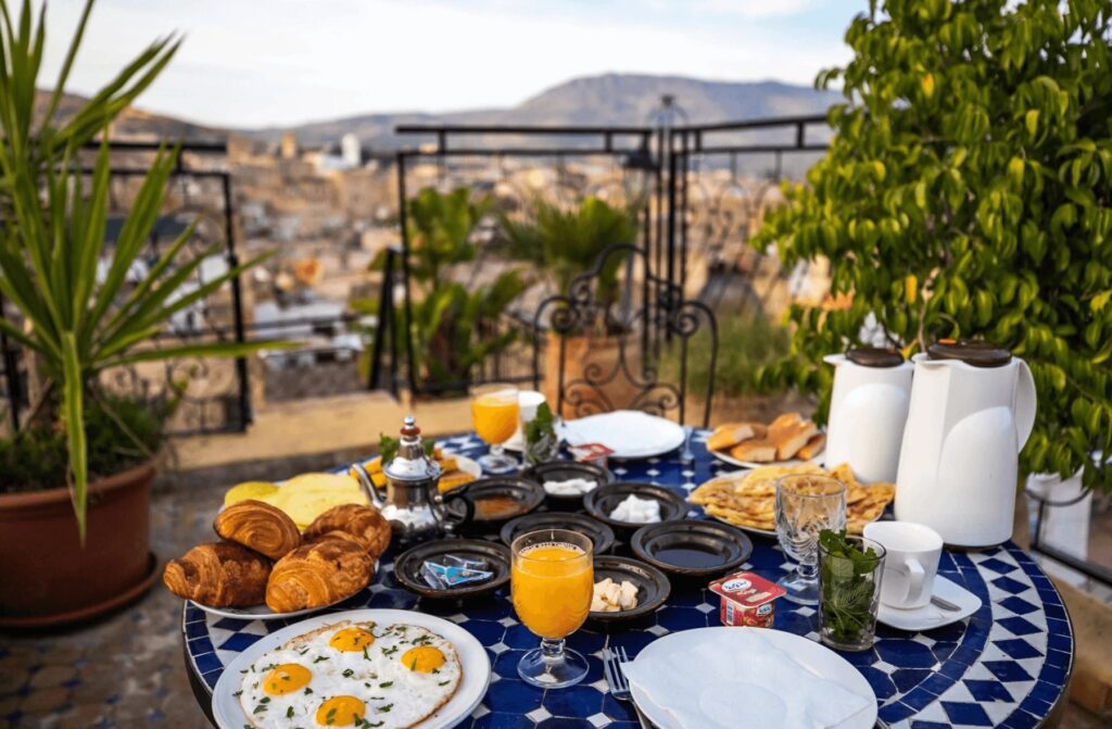 A traditional Moroccan breakfast with a view on the terrace at Riad Fes Aicha 