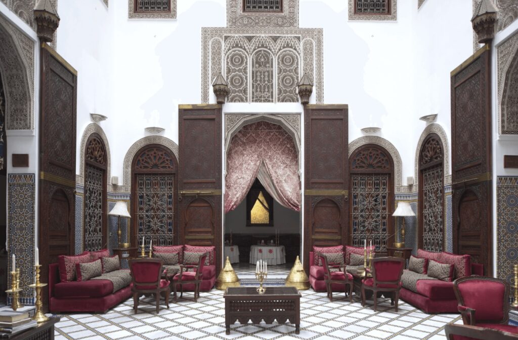 The luxurious inner courtyard of Riad Maison Bleue & Spa, one of the best hotels in Fes with a hammam