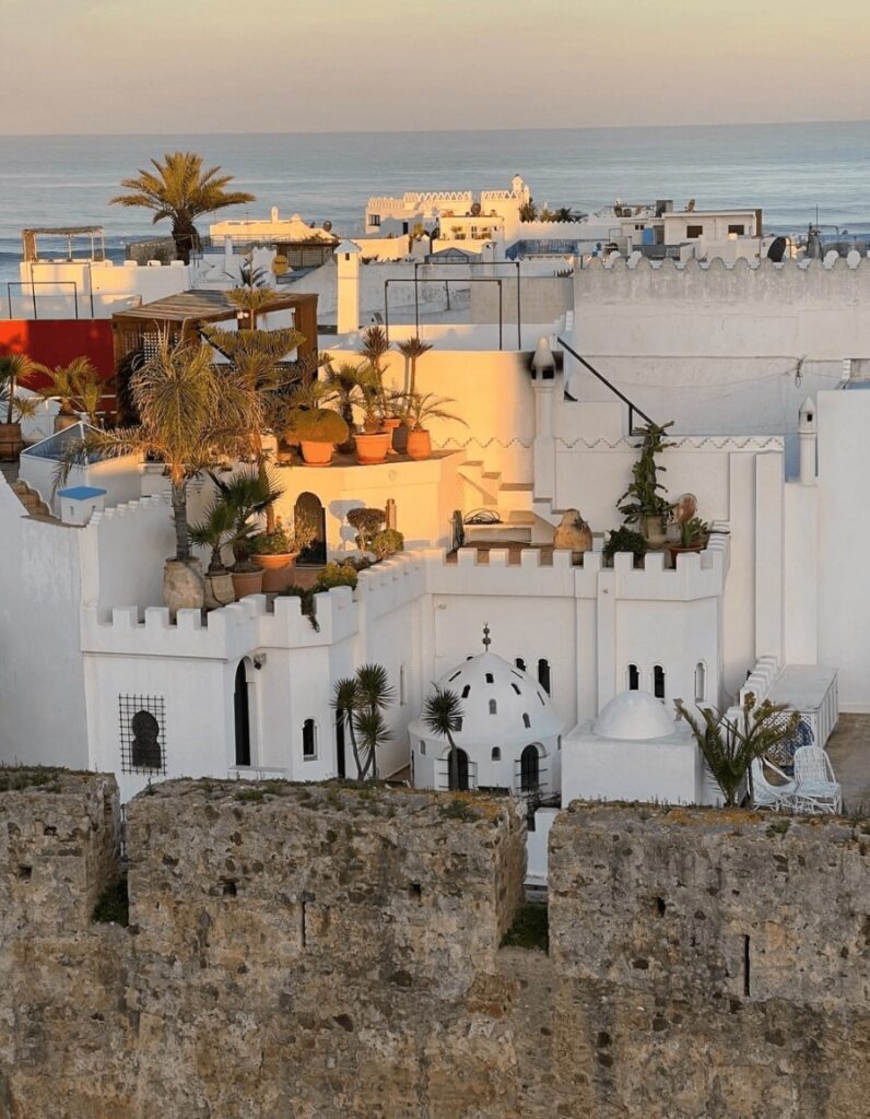The whitewashed buildings of Riad Oasis d'Asilah rise above the medina's stone walls 