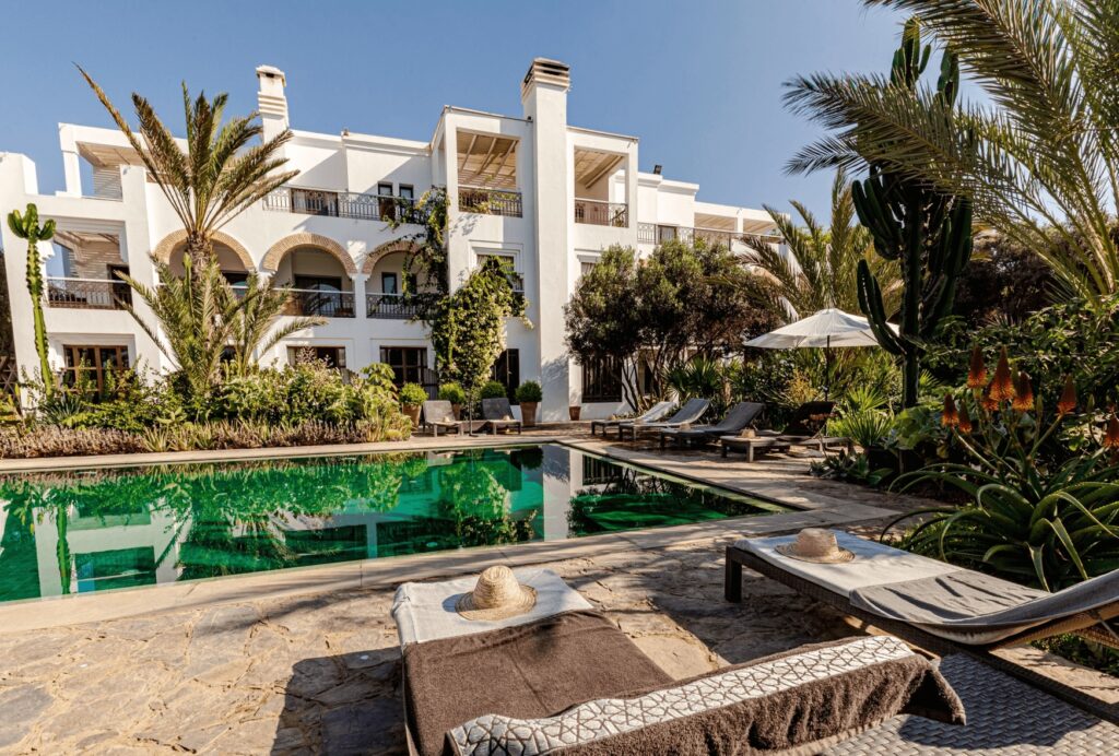 Sun loungers frame the swimming pool at Le Riad Villa Blanche, one of the best hotels in Agadir