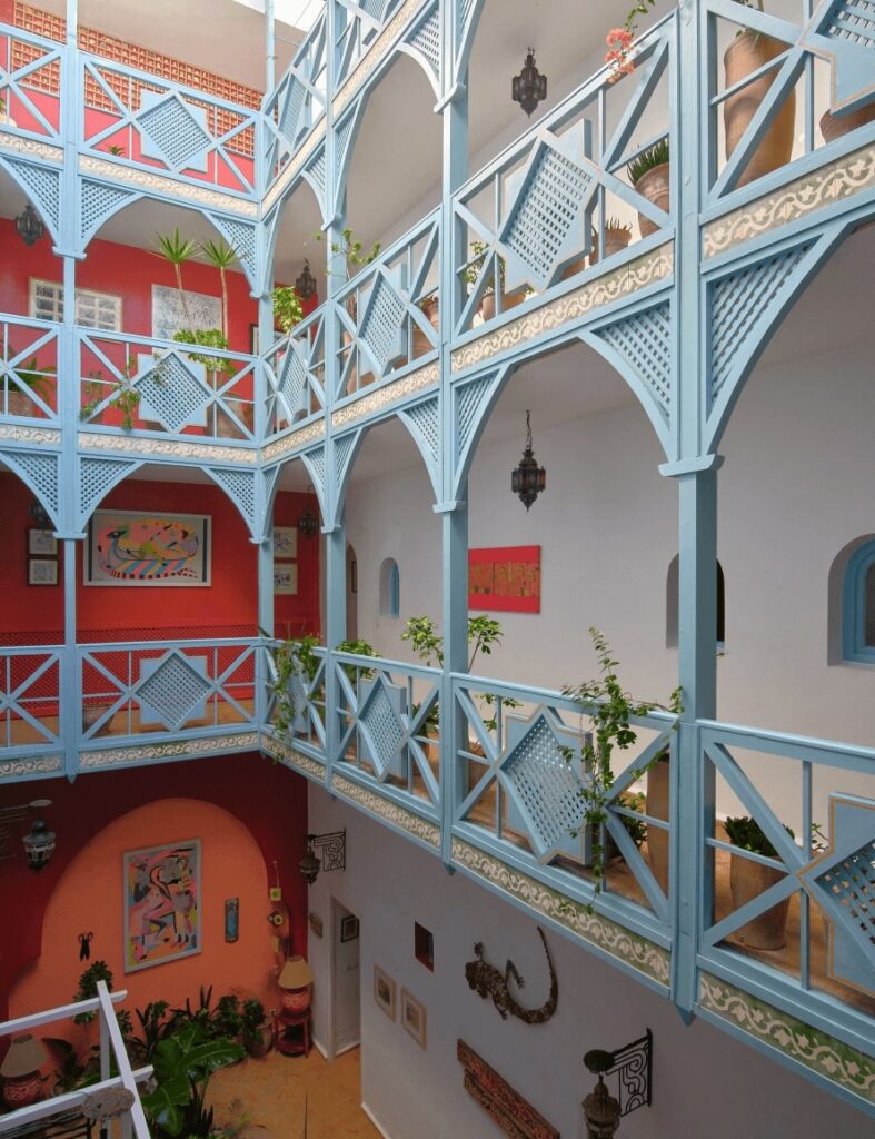 Sky blue balconies decorate the interior courtyard of Ryad Watier & Spa in Essaouira