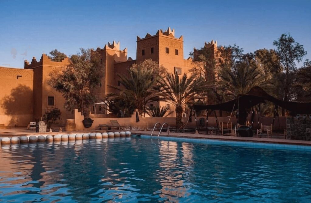 Best places to stay in M'Hamid El Ghizlane - A large pool in front of the kasbah-inspired architecture of Sbai Palace in M'Hamid El Ghizlane 