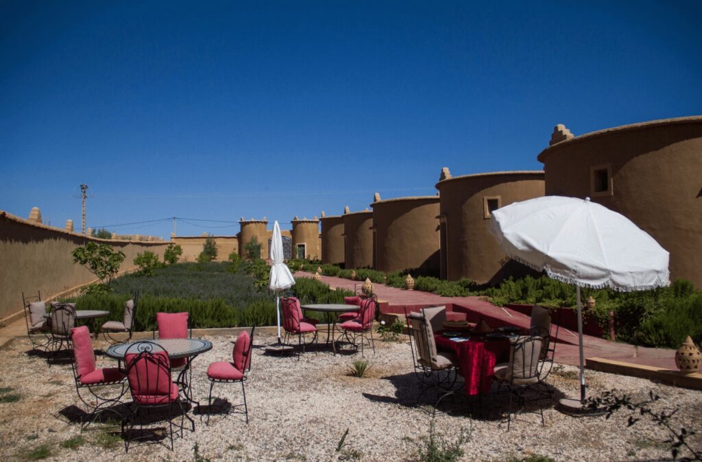 Round houses beside the sun-drenched gardens of Skoura Lodge