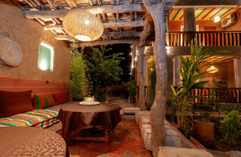 A lantern illuminates an outdoor lounge at one of the best hotels in Imlil