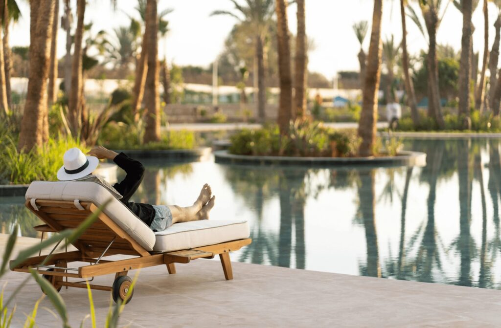Relaxing beside a lagoon-like swimming pool at The View, one of the best hotels with a pool in Agadir