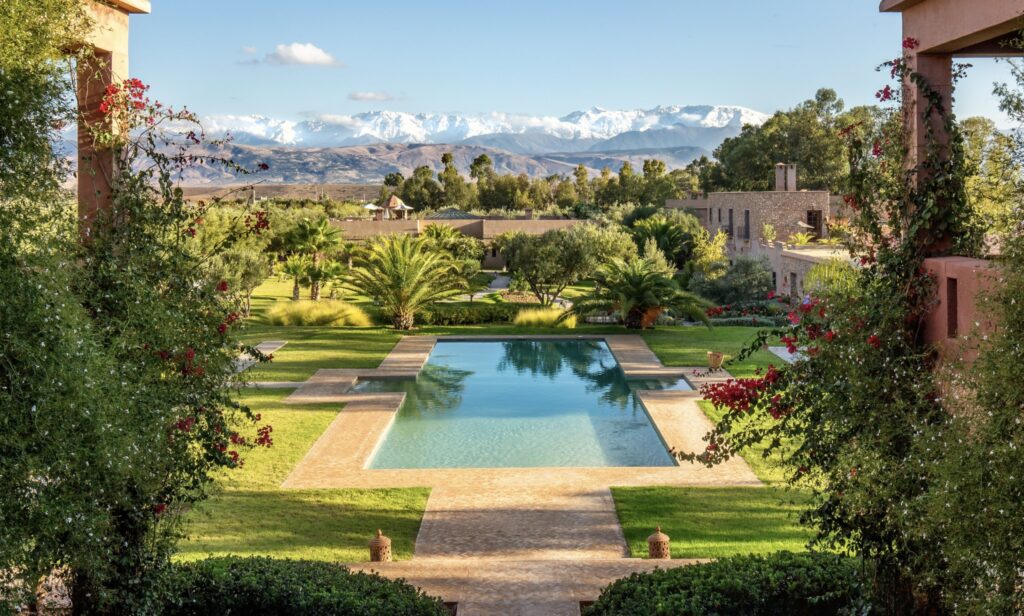 A swimming pool backed by the Atlas Mountains at one of the best luxury hotels near Agafay