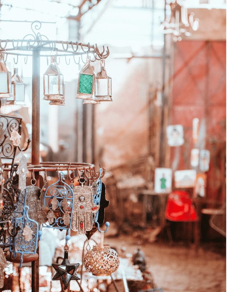 Travel guide to Tiznit: Silver trinkets hang at a Moroccan market stall