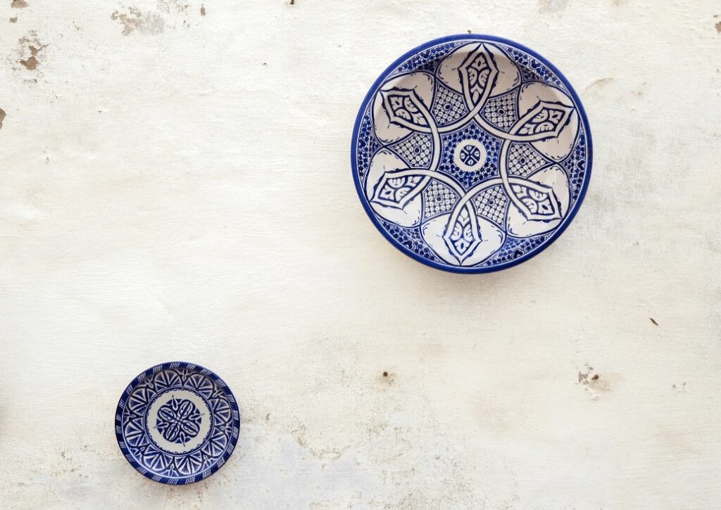 Travel guide to Safi: Ceramic plates displayed on a whitewashed wall